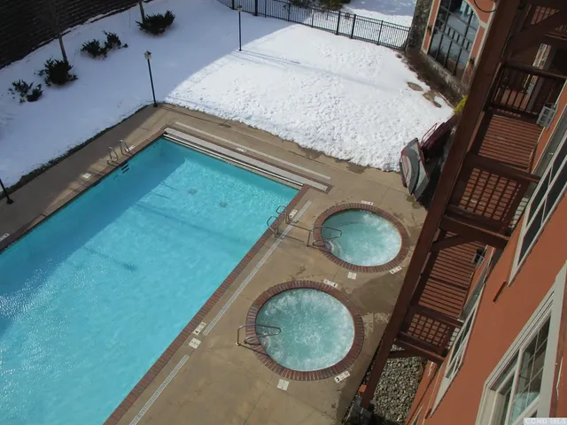 a kitchen with a sink and a mirror