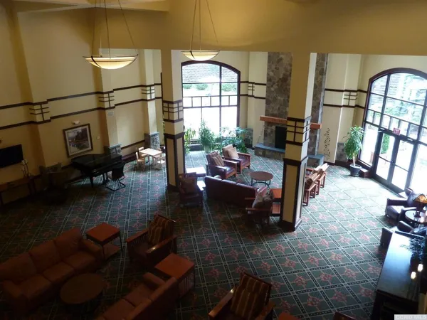 a living room with furniture stove and a window