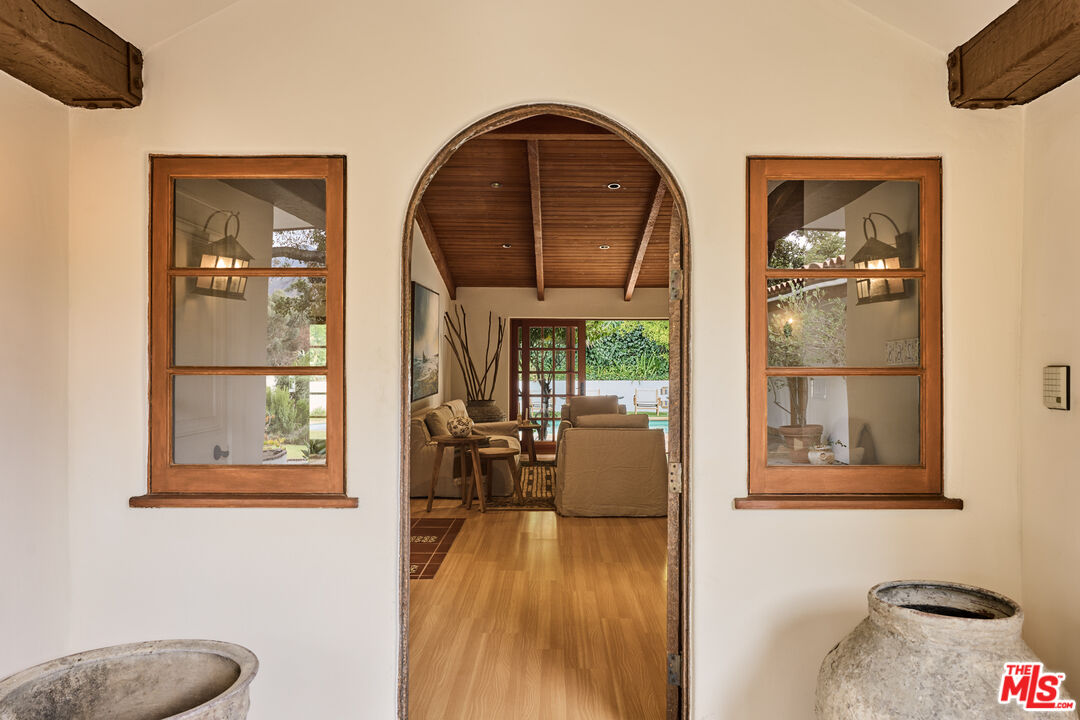 3268 Serra Road Malibu, CA 90265 - Photo 4 of 24 a view of livingroom with furniture and wooden floor