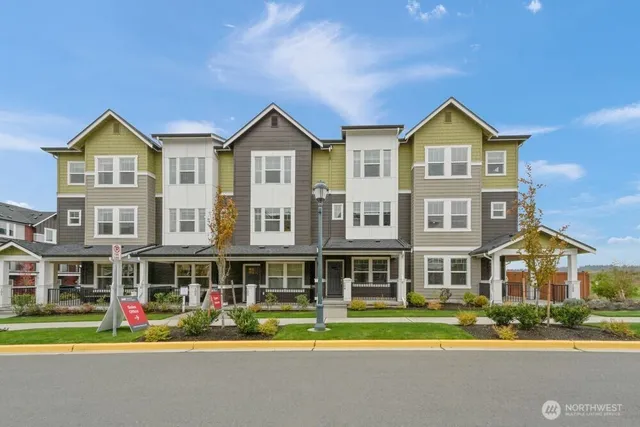 a front view of residential houses with street