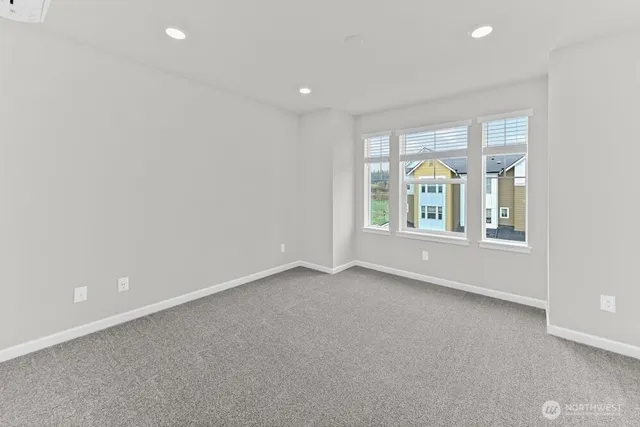 an empty room with windows and view