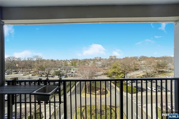 a view of a balcony with furniture