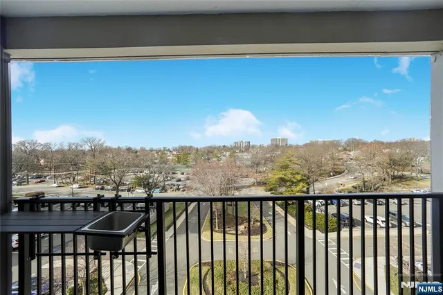 a view of a balcony with furniture