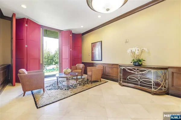 a view of living room kitchen and entryway