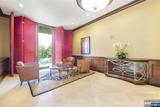 a view of living room kitchen and entryway