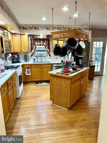 a living room with furniture gym equipment and a large window