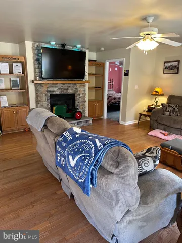 a living room with furniture and a fireplace