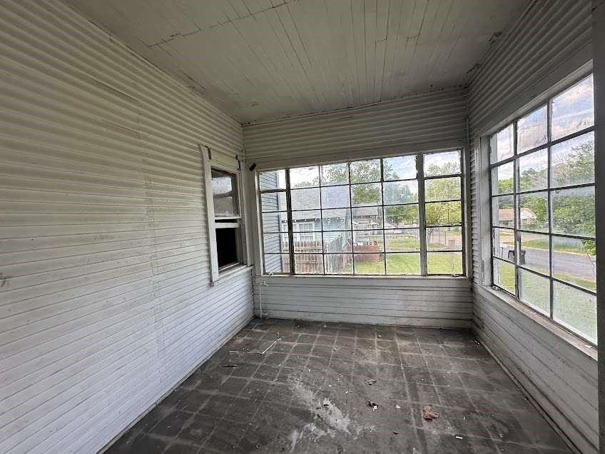 107 Electra Street Longview, TX 75602 - Photo 3 of 12 a view of empty room with wooden floor and fan