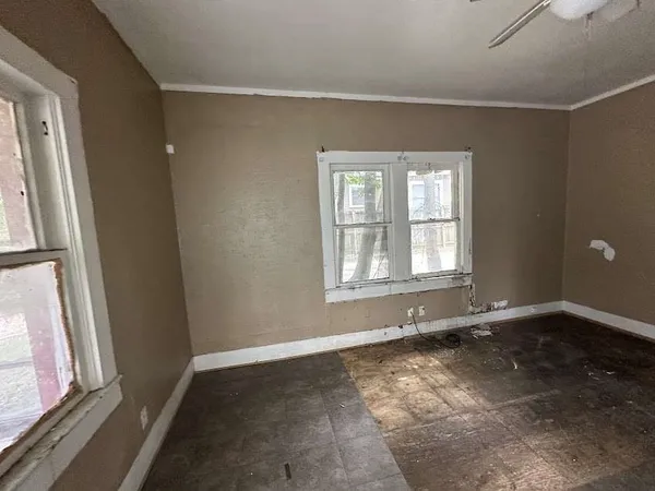 an empty room with windows