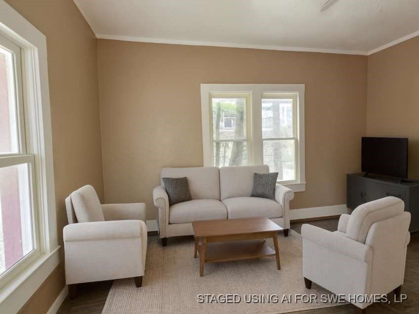 107 Electra Street Longview, TX 75602 - Photo 6 of 12 a living room with furniture a couch and a flat screen tv