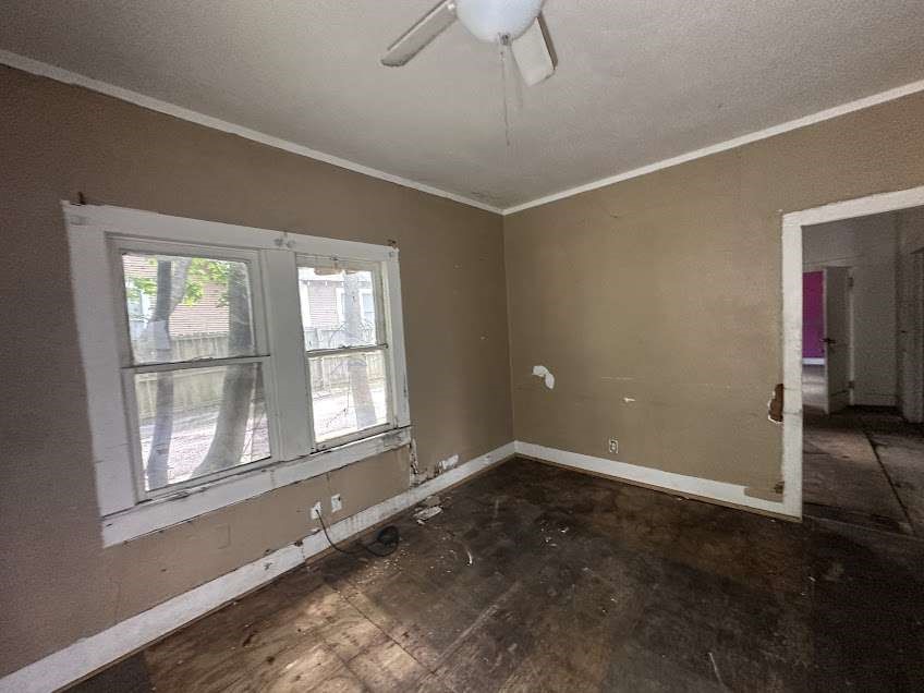 107 Electra Street Longview, TX 75602 - Photo 7 of 12 a view of empty room with wooden floor and fan