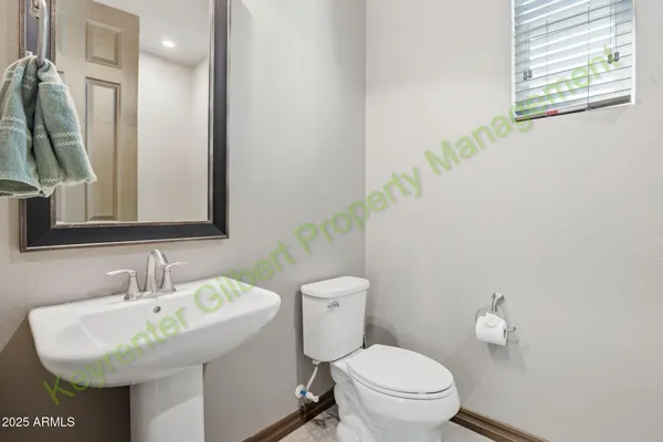 a view of an entryway with wooden floor and a chandelier