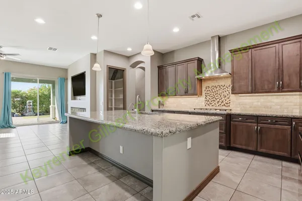 a kitchen with stainless steel appliances granite countertop a stove and a sink