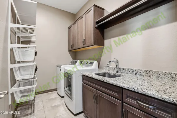 a kitchen with granite countertop a sink and a stove