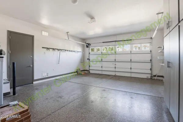 a bathroom with a sink and mirror with toilet