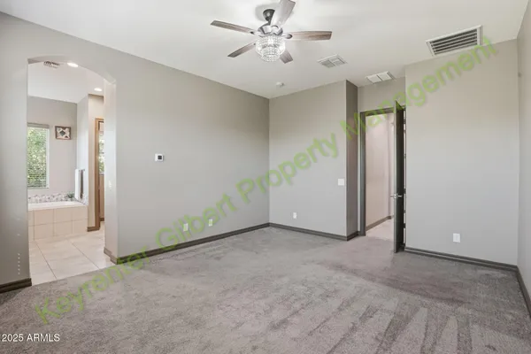 a bath room with a granite countertop sink and a mirror
