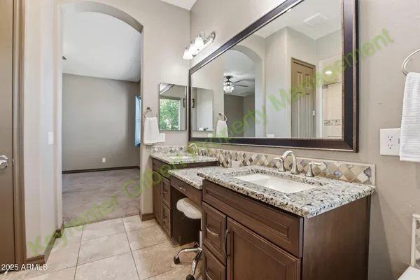 a bathroom with a shower and a glass door