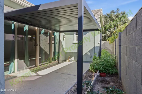 a view of a park with swings on the side of the road