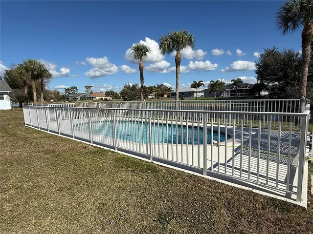 a view of balcony with wooden floor and fence
