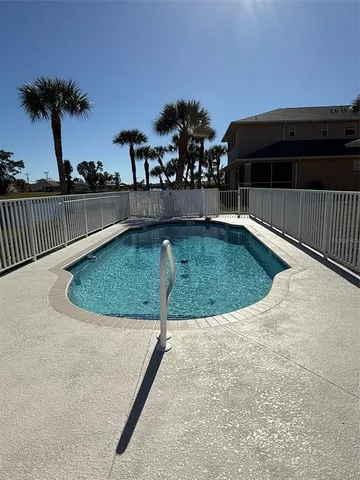 a view of swimming pool from a balcony