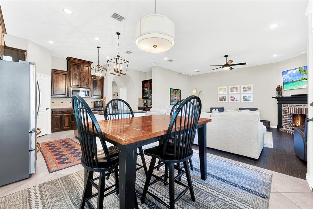 10104 Gentry Drive Frisco, TX 75035 - Photo 12 of 39 a view of a a dining room with furniture window and wooden floor