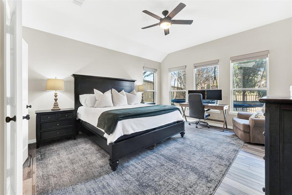 10104 Gentry Drive Frisco, TX 75035 - Photo 16 of 39 a bedroom with a bed a couch and large window