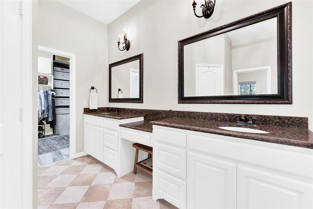 10104 Gentry Drive Frisco, TX 75035 - Photo 19 of 39 a bathroom with a sink and a mirror