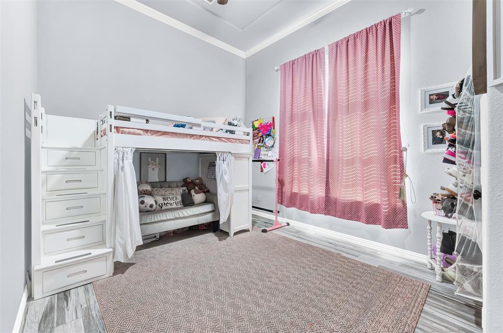 10104 Gentry Drive Frisco, TX 75035 - Photo 27 of 39 a bedroom with a bed and a window