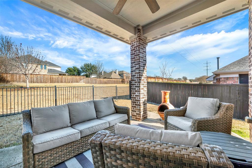 10104 Gentry Drive Frisco, TX 75035 - Photo 30 of 39 a roof deck with couches and wooden floor