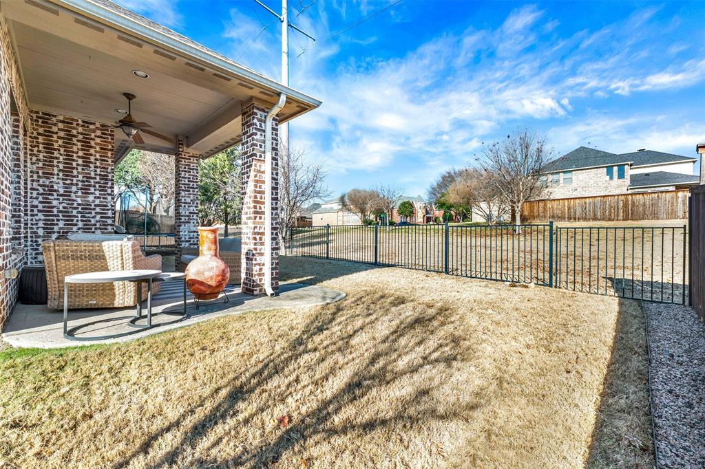 10104 Gentry Drive Frisco, TX 75035 - Photo 32 of 39 a view of a terrace with a bench