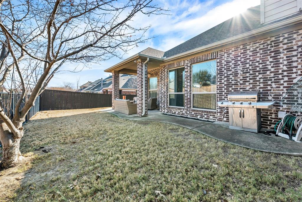 10104 Gentry Drive Frisco, TX 75035 - Photo 33 of 39 a view of a house with a yard