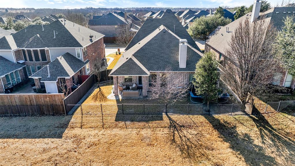 10104 Gentry Drive Frisco, TX 75035 - Photo 37 of 39 a view of house with wooden floor and outdoor seating