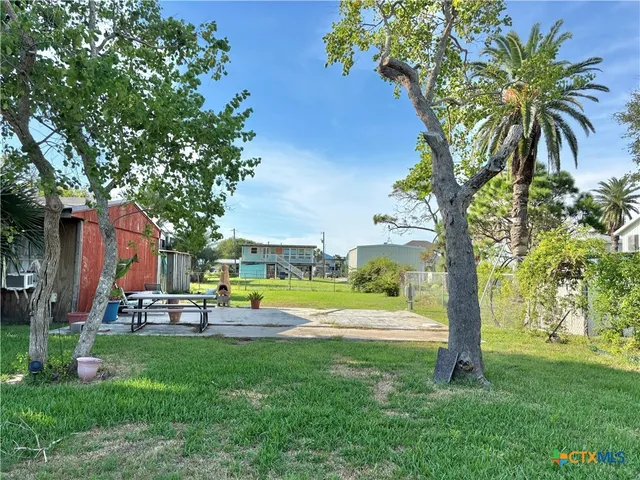 a view of a swimming pool with a table and chairs