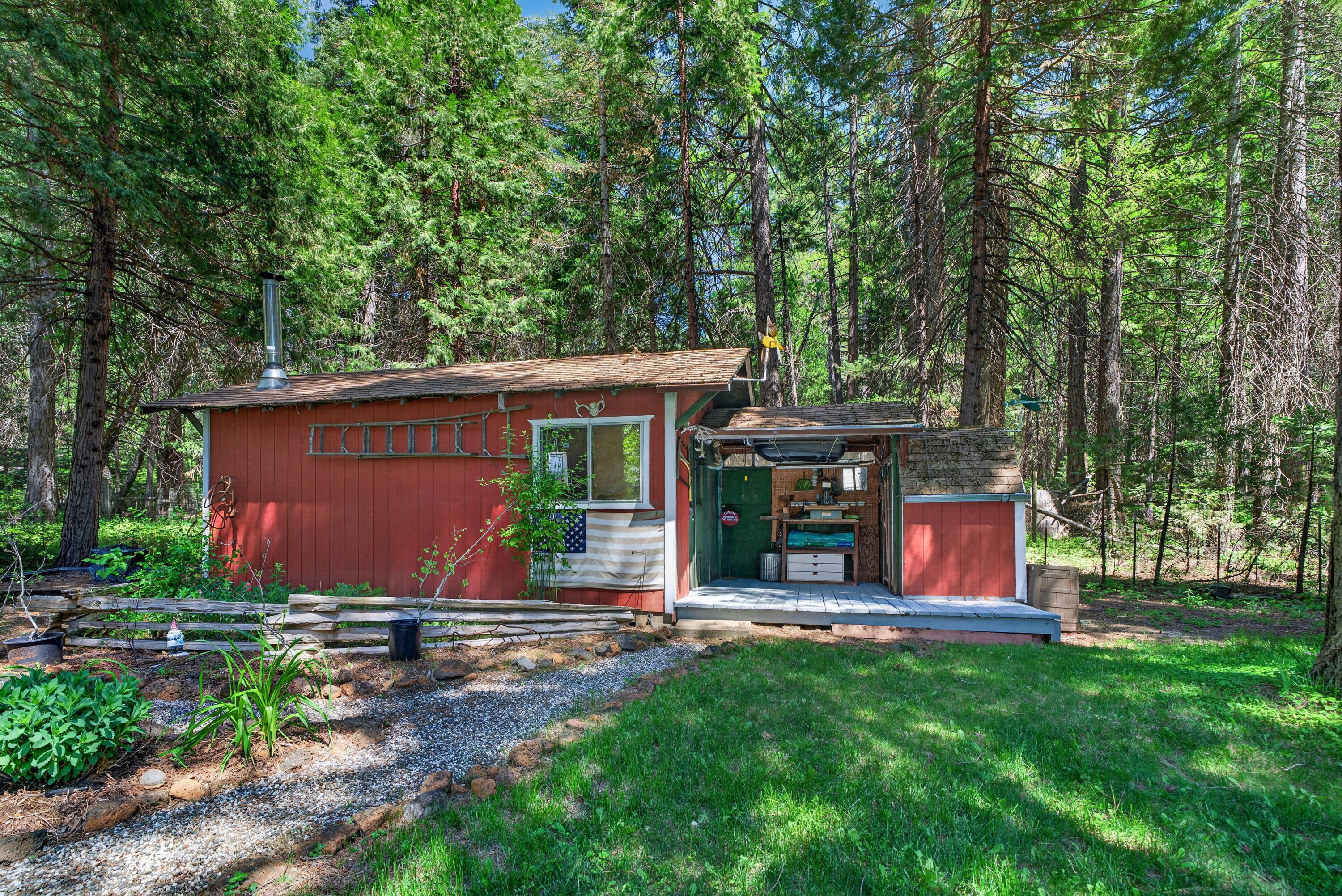 8015 Starlite Pines Road Shingletown, CA 96088 - Photo 33 of 38 a view of a house with backyard and sitting area