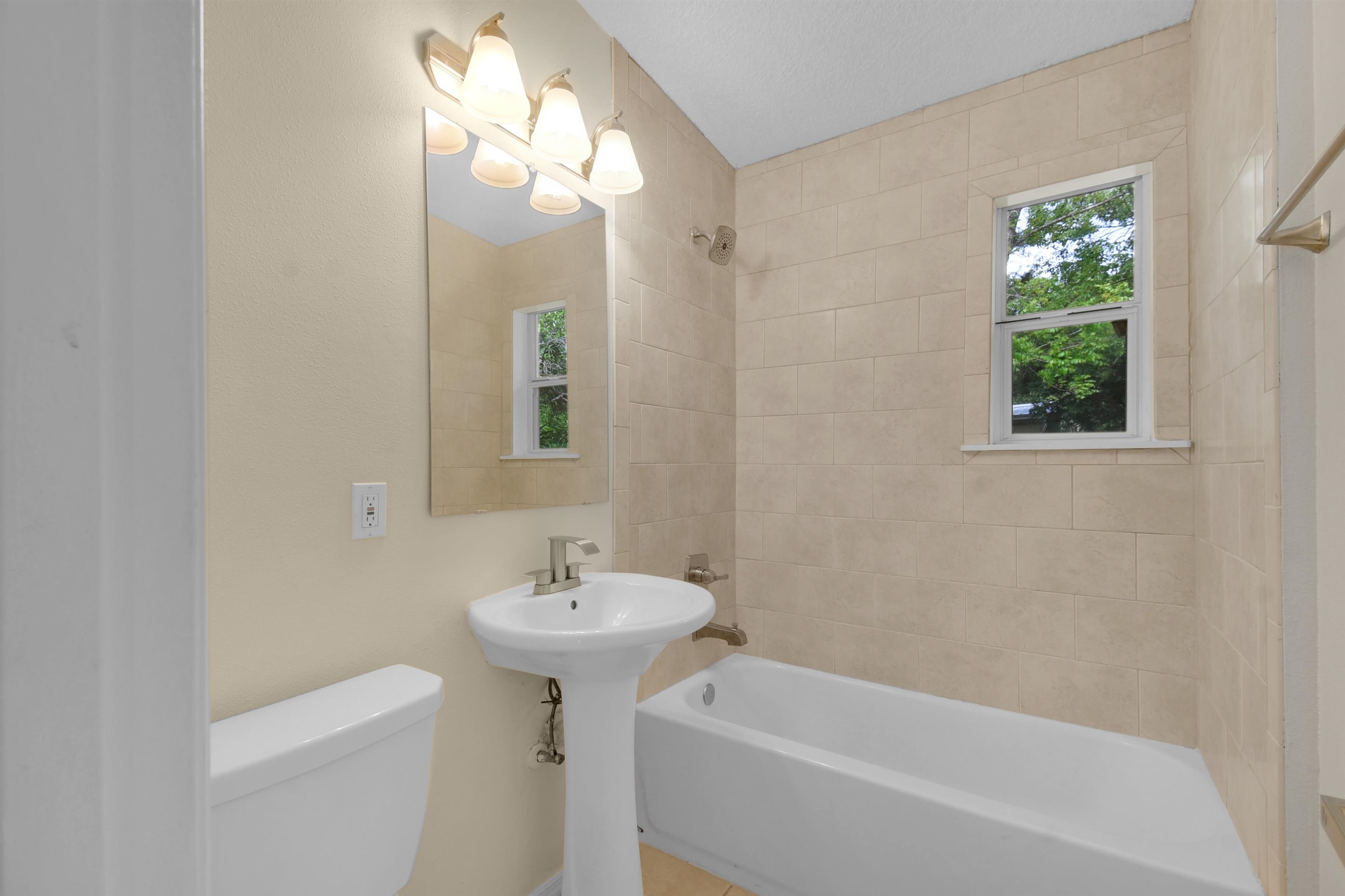 228 Spring Street St. Augustine, FL 32084 - Photo 30 of 38 Has Tub/Shower combo with new lighting, faucet & shower head