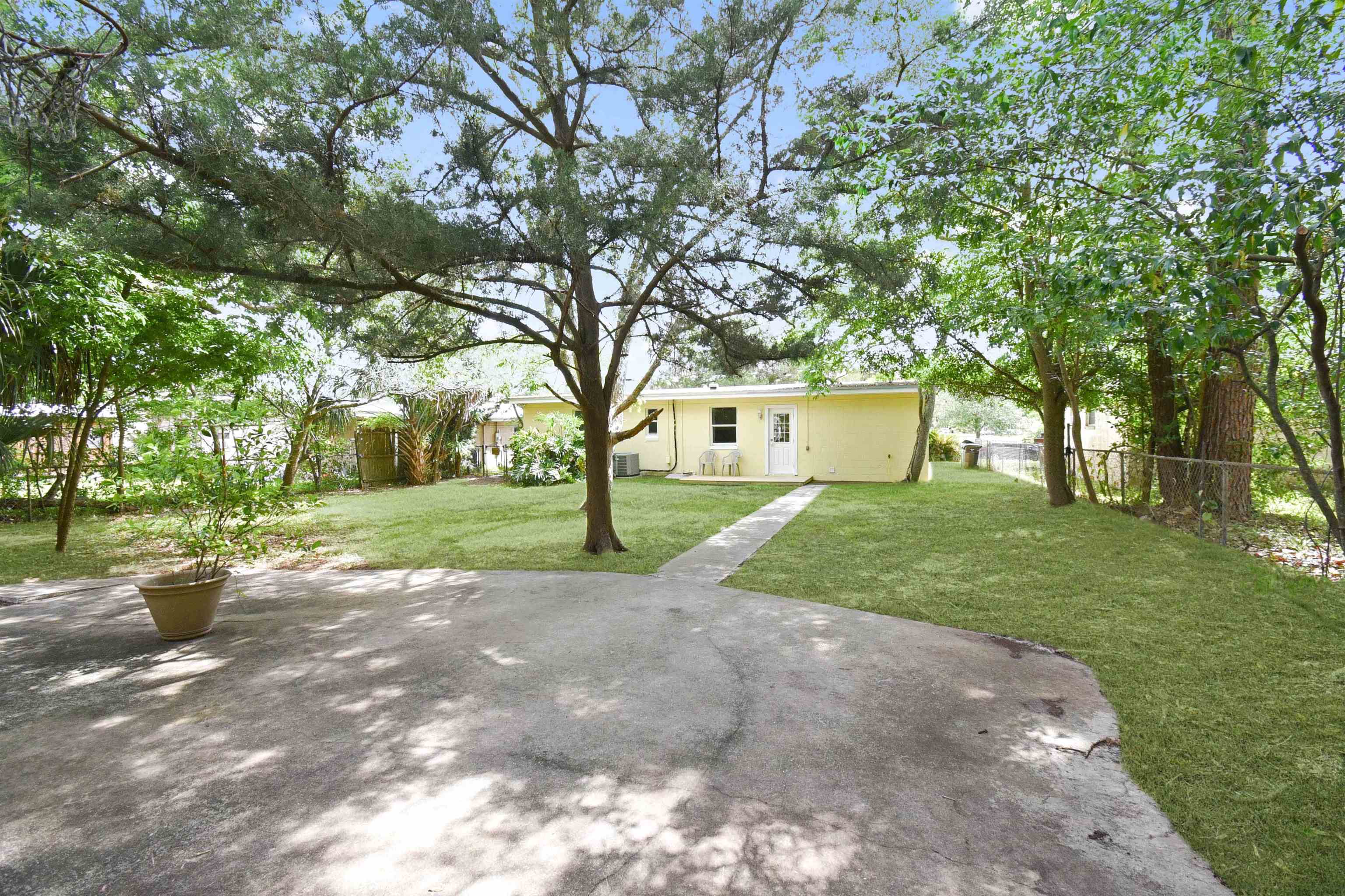 228 Spring Street St. Augustine, FL 32084 - Photo 32 of 38 Has big cement pad by garage area & lots of shade