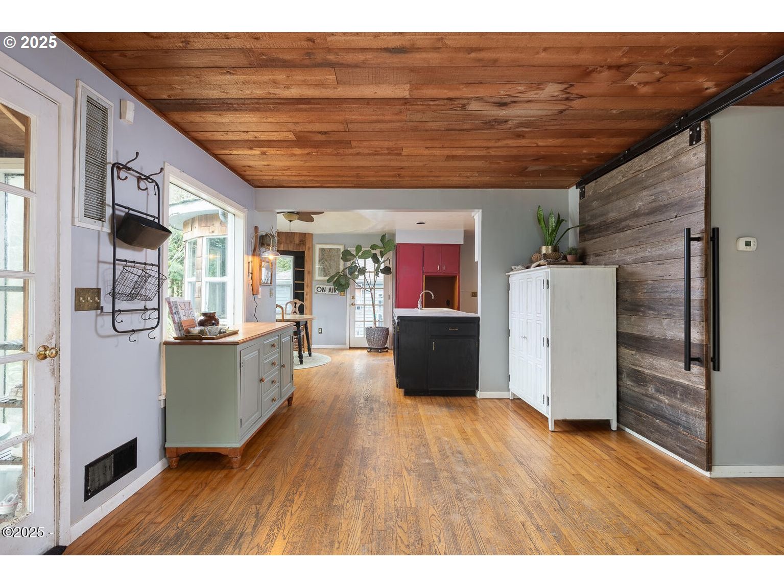381 South Anderson Creek Road Lincoln City, OR 97367 - Photo 13 of 48 a living room with furniture and kitchen view