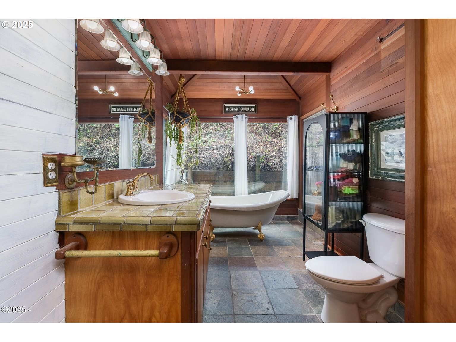 381 South Anderson Creek Road Lincoln City, OR 97367 - Photo 19 of 48 a view of a patio with table and chairs potted plants with wooden floor