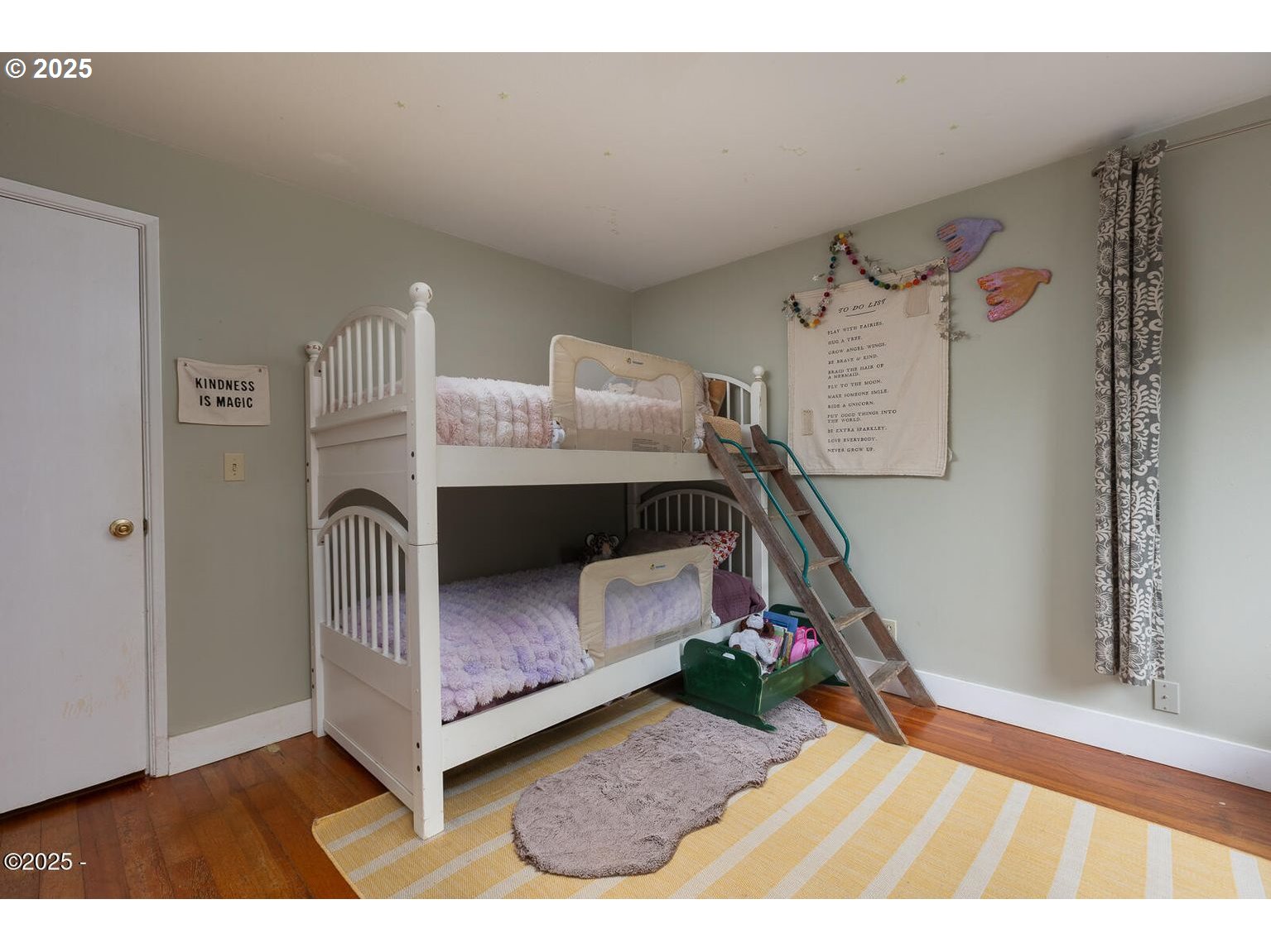 381 South Anderson Creek Road Lincoln City, OR 97367 - Photo 24 of 48 a bedroom with a bed and a wooden floor