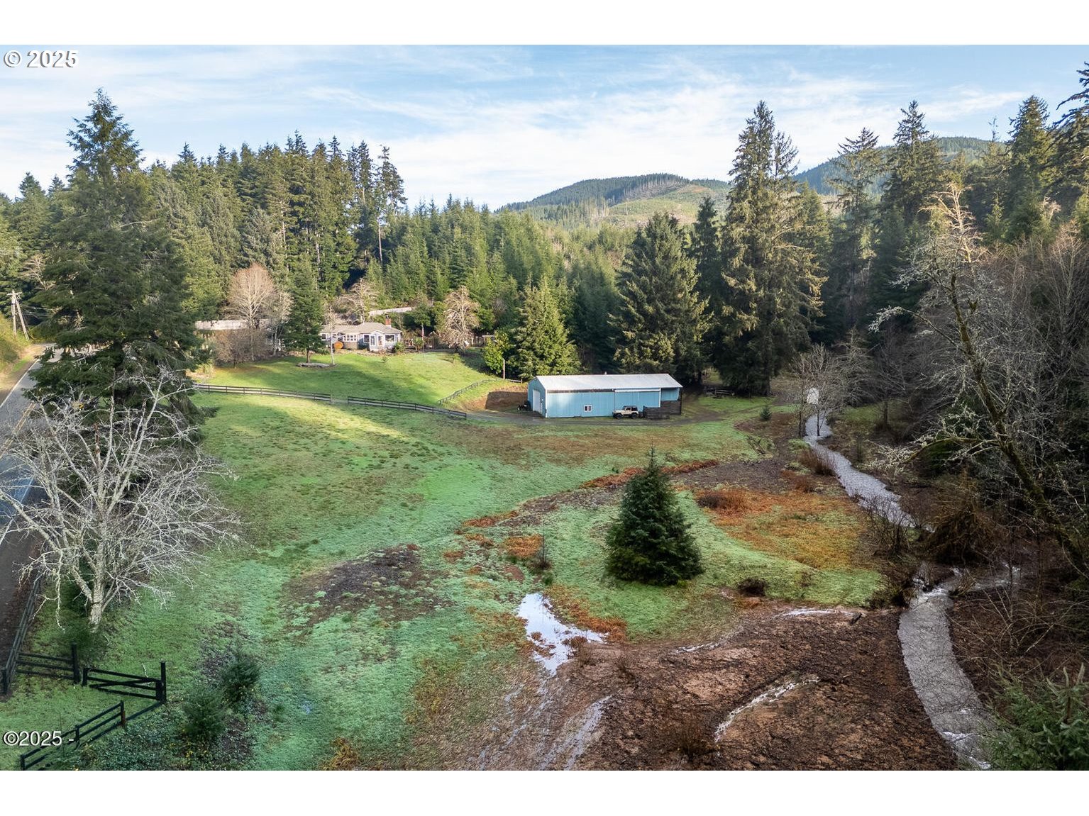 381 South Anderson Creek Road Lincoln City, OR 97367 - Photo 36 of 48 a view of a town with mountains in the background