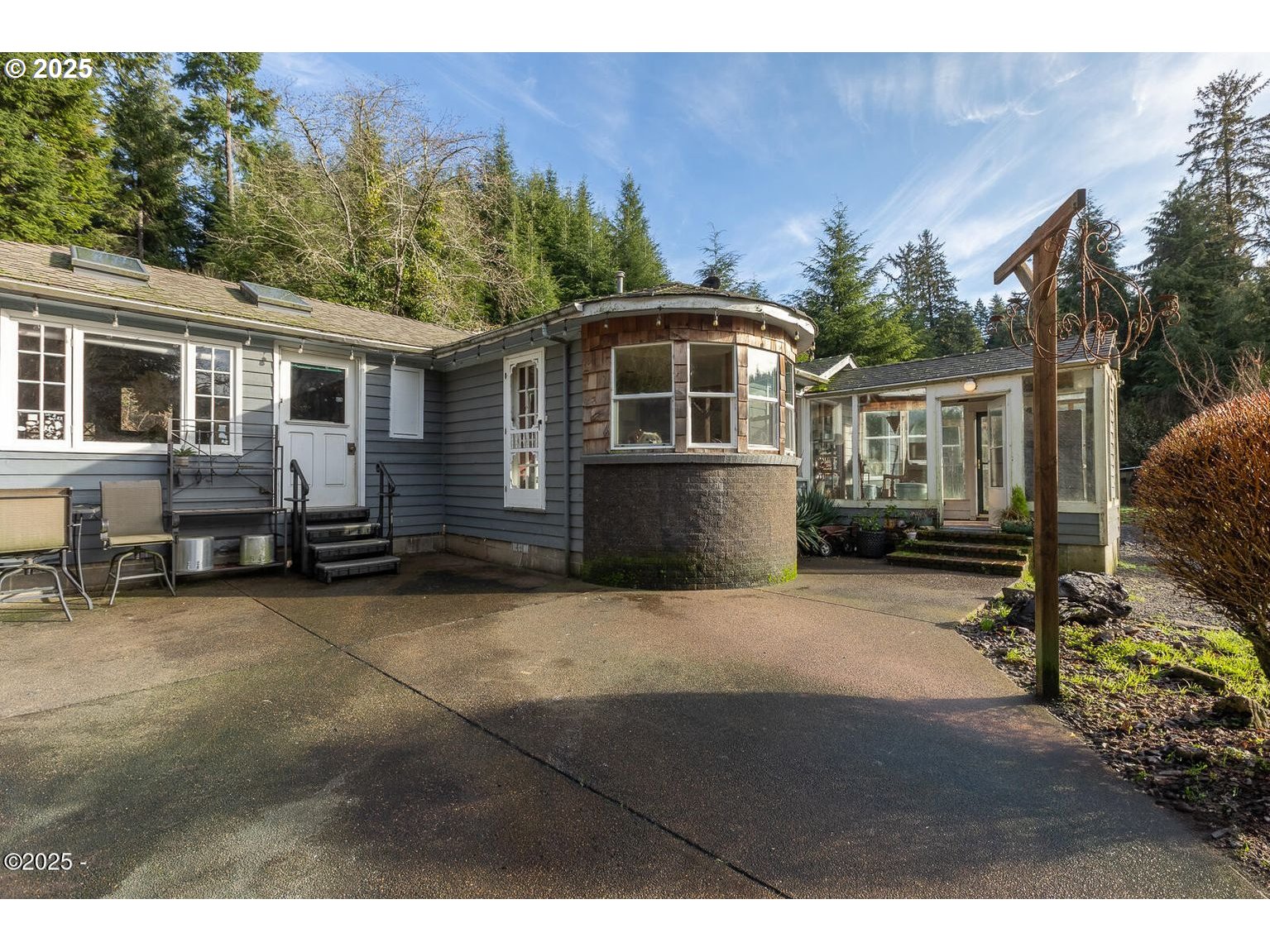 381 South Anderson Creek Road Lincoln City, OR 97367 - Photo 6 of 48 a front view of a house with a yard