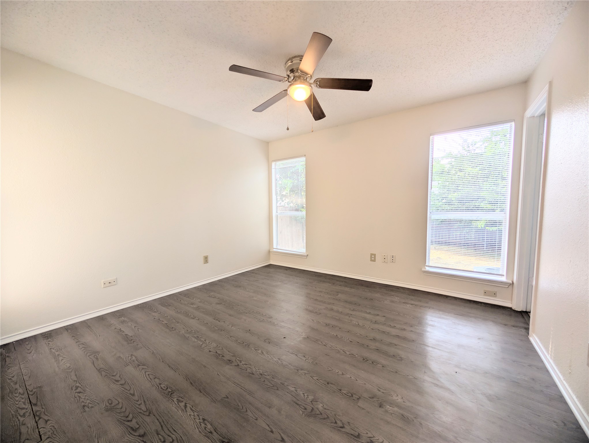 2016 Redwing Way Round Rock, TX 78664 - Photo 8 of 19 Primary Bedroom:
An airy bedroom with resilient wood-look flooring and a modern ceiling fan for comfort.