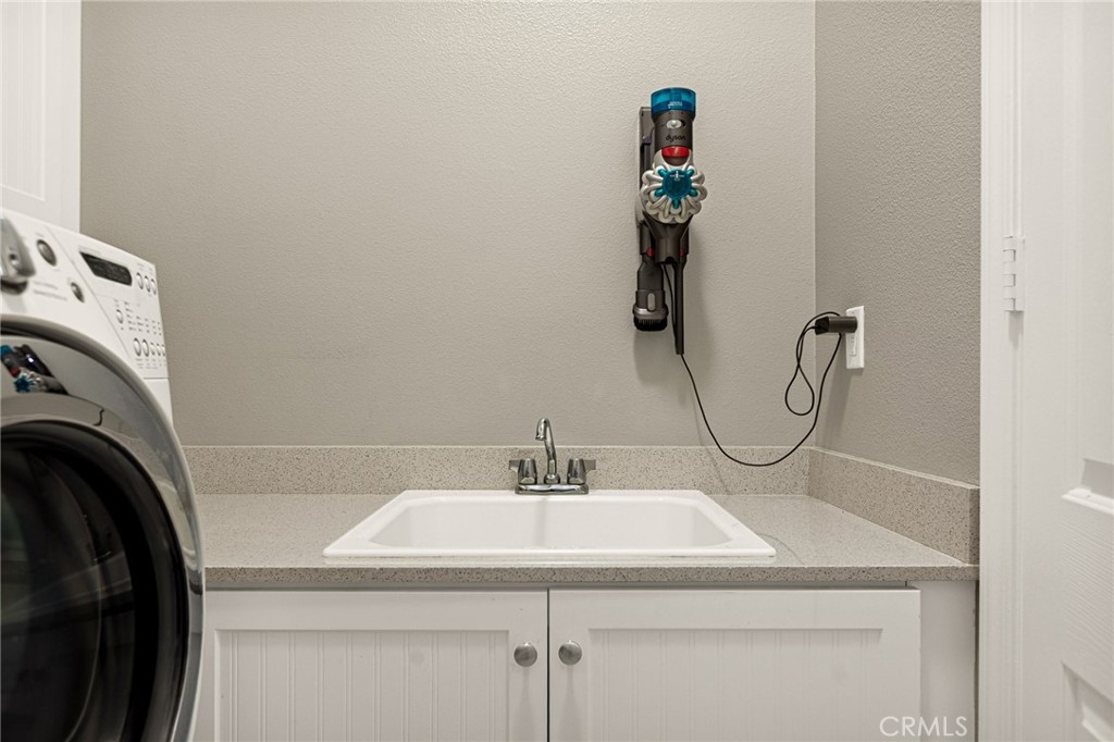 1576 Timberline Beaumont, CA 92223 - Photo 23 of 26 a bathroom with a sink and a mirror