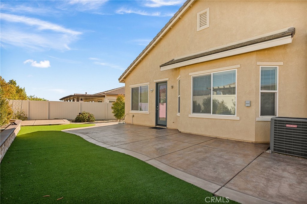 1576 Timberline Beaumont, CA 92223 - Photo 25 of 26 a view of a house with backyard and a garden