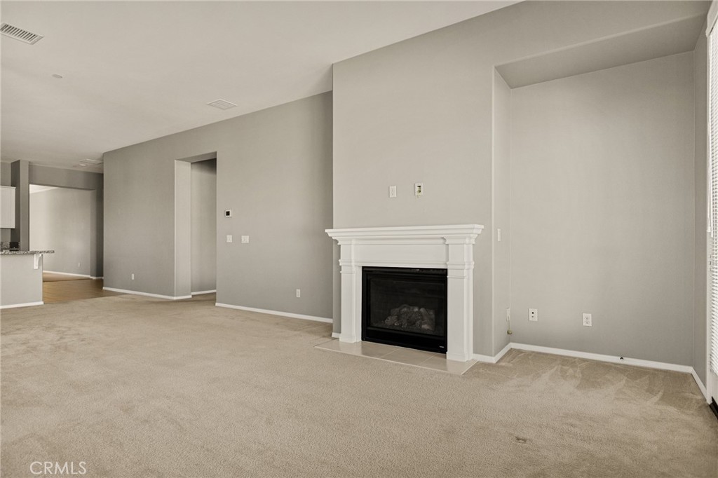 1576 Timberline Beaumont, CA 92223 - Photo 3 of 26 an empty room with a fireplace