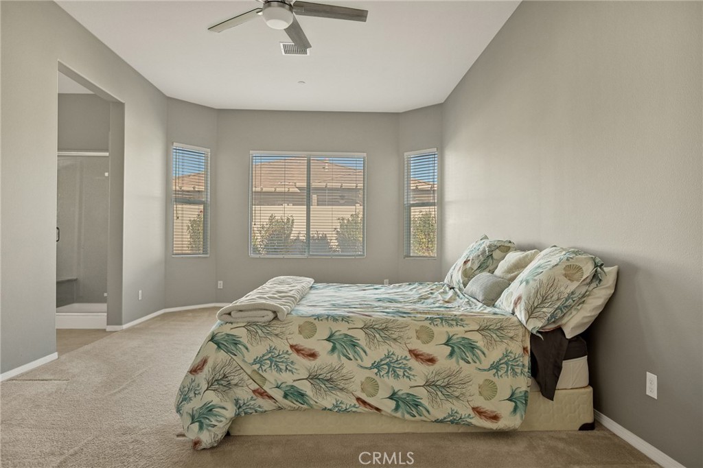 1576 Timberline Beaumont, CA 92223 - Photo 9 of 26 a bedroom with bed and window