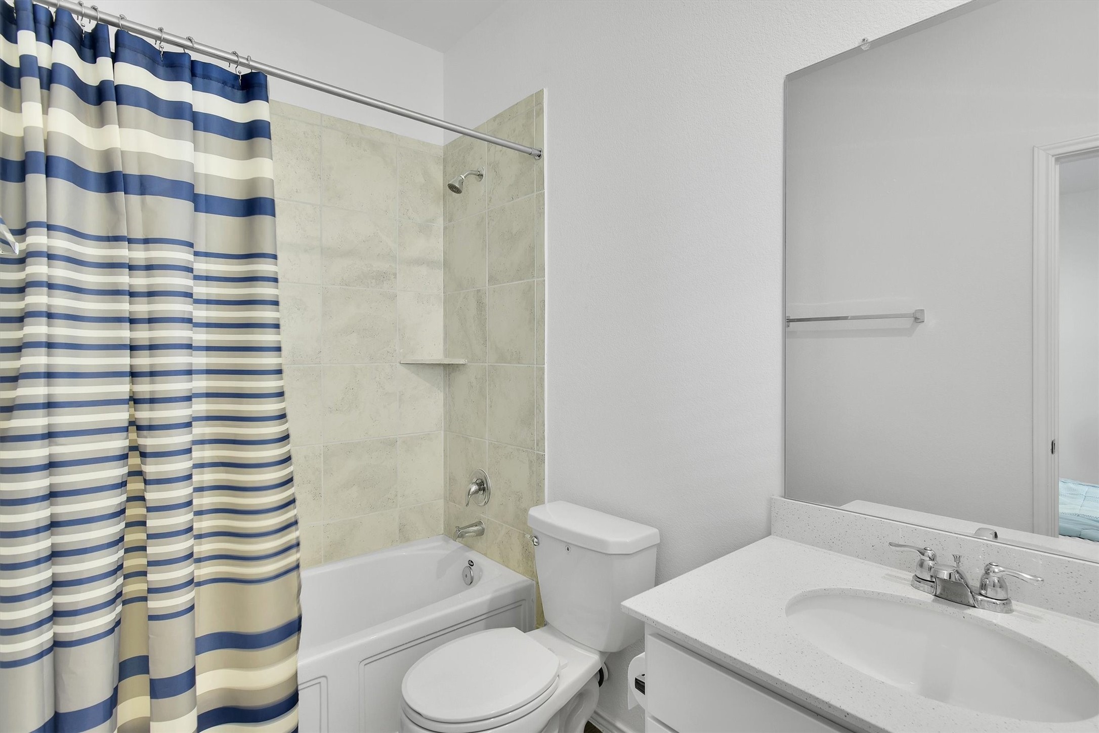 1621 Brueggerhoff Road Leander, TX 78641 - Photo 16 of 28 Full bathroom featuring toilet, vanity, and shower / bathtub combination with curtain