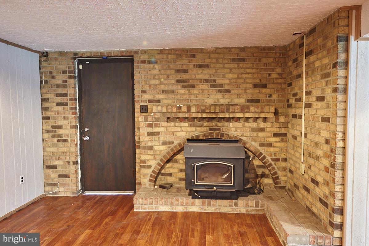 4914 Sharon Road Temple Hills, MD 20748 - Photo 17 of 25 Basement, exposed brick, second fireplace