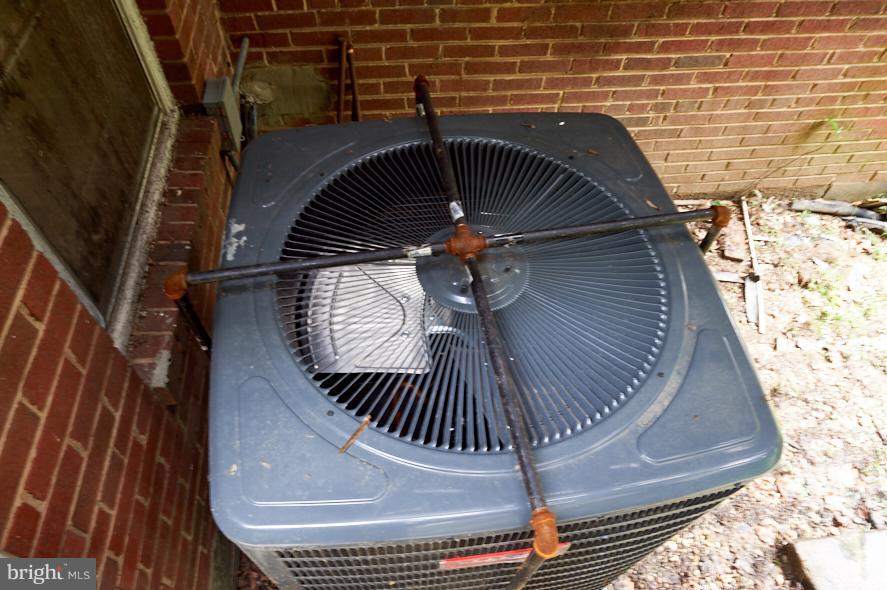 4914 Sharon Road Temple Hills, MD 20748 - Photo 22 of 25 Exterior (Rear) New Heat Pump w/ security cage