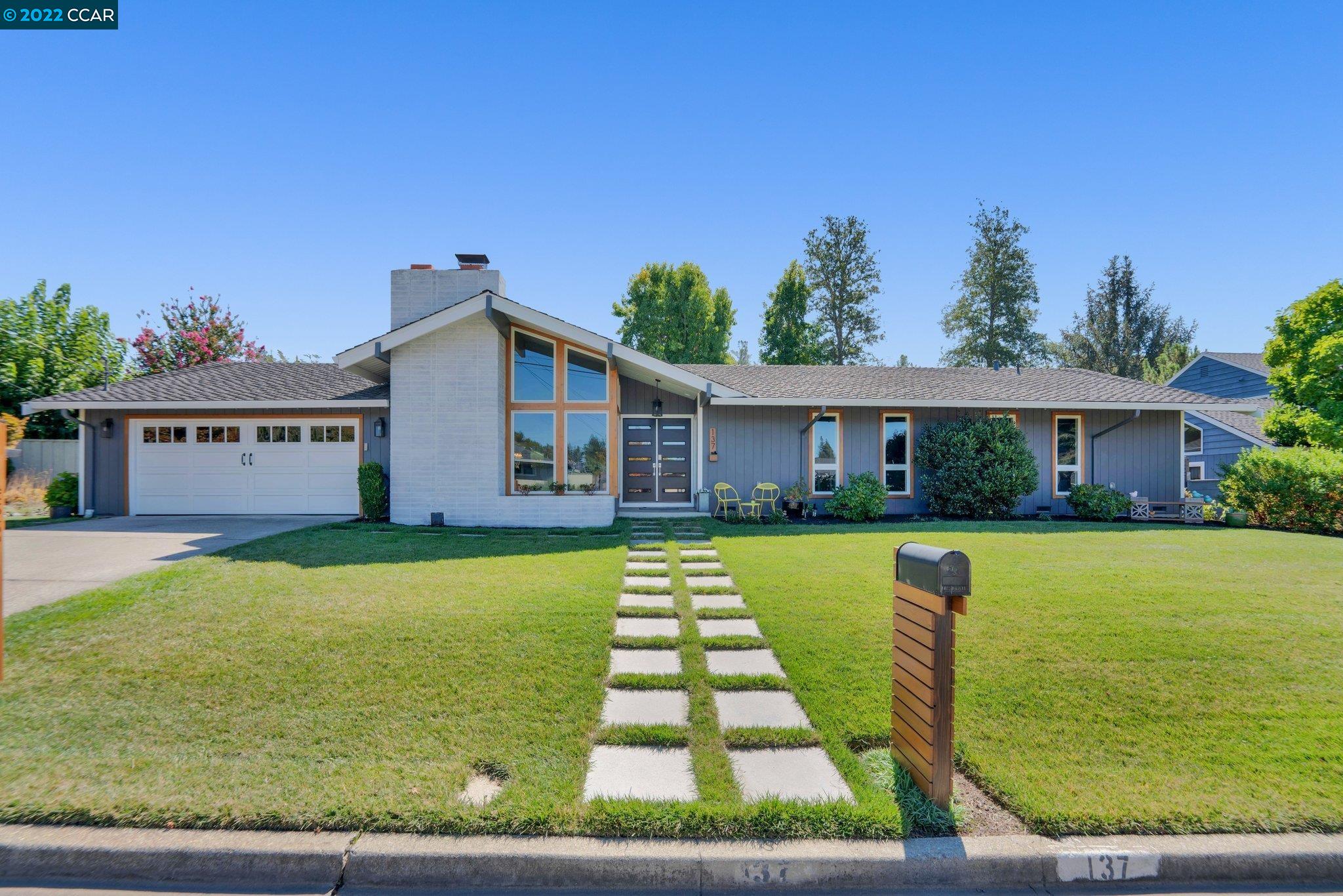 137 Tharp Drive Moraga, CA 94556 - Photo 1 of 1 a front view of house with yard and seating area